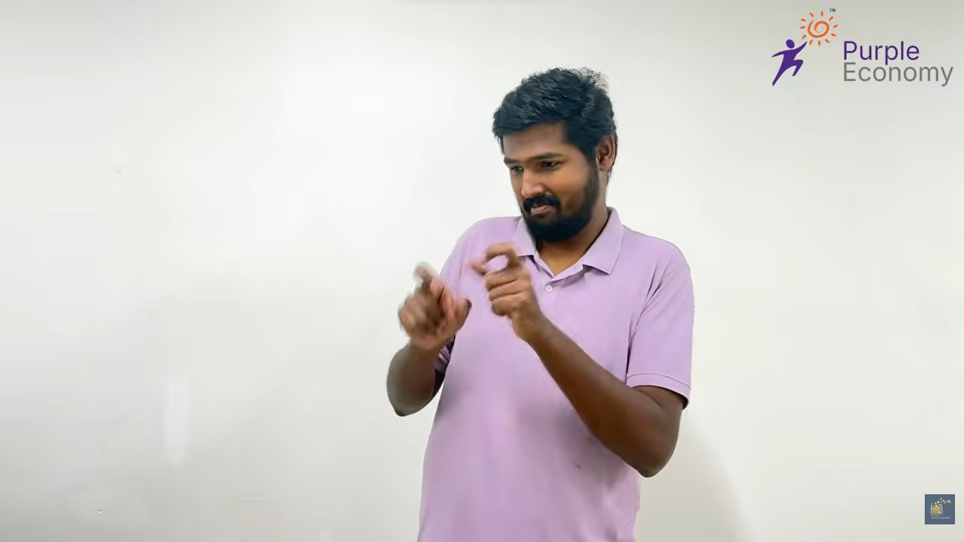 Person demonstrating sign language with Purple Economy logo.