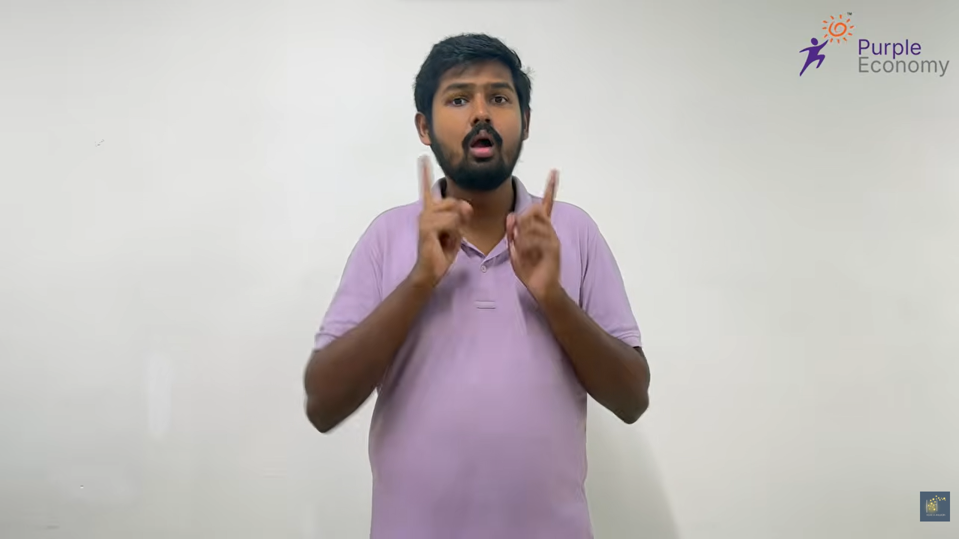 Person using sign language with Purple Economy logo.